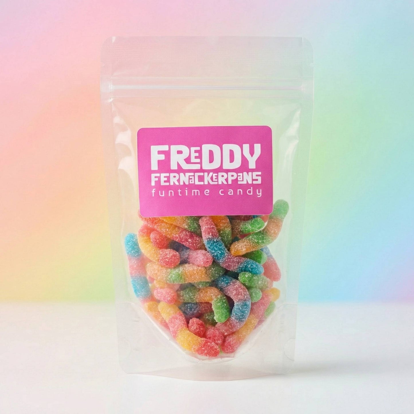 Packaged candy with a pink label on a colorful gradient background